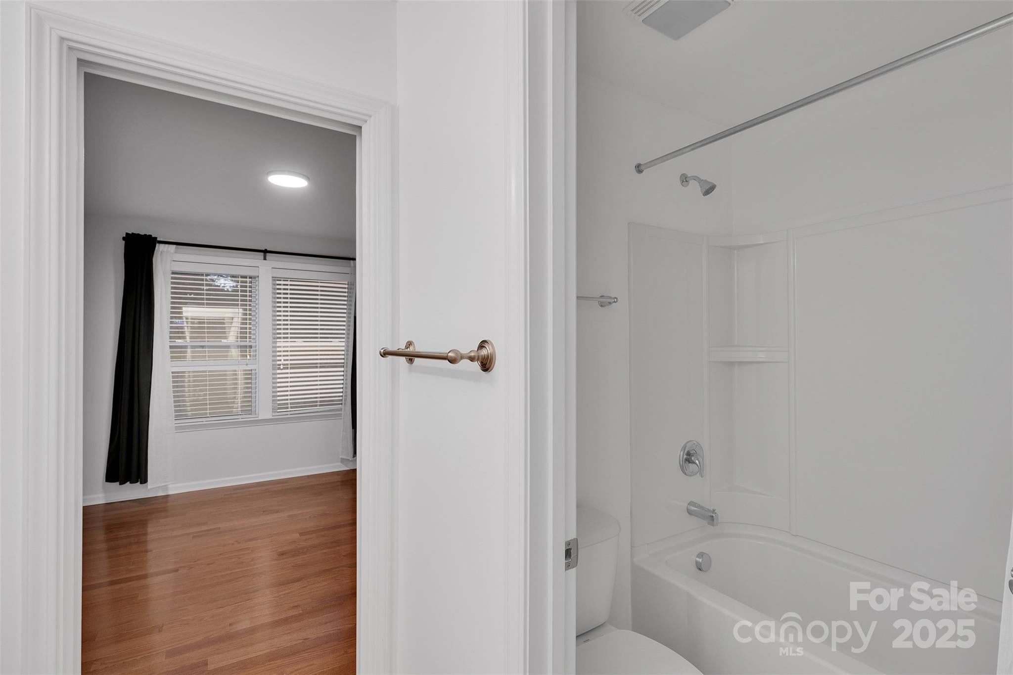 226 Bubbling Well Road Matthews, NC 28105 - Photo 39 of 47 a bathroom with a bathtub and shower