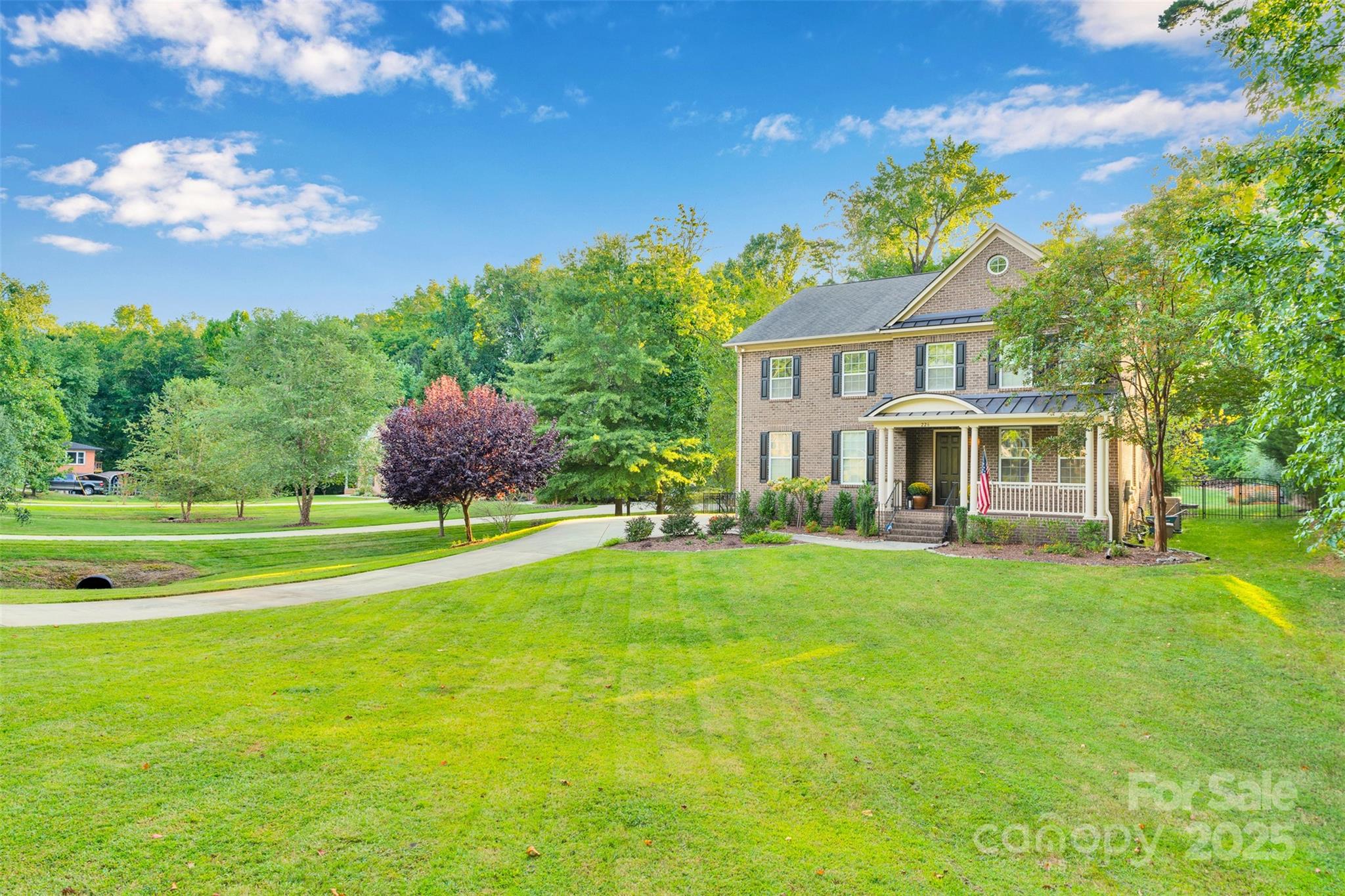 226 Bubbling Well Road Matthews, NC 28105 - Photo 6 of 47 a front view of a house with garden