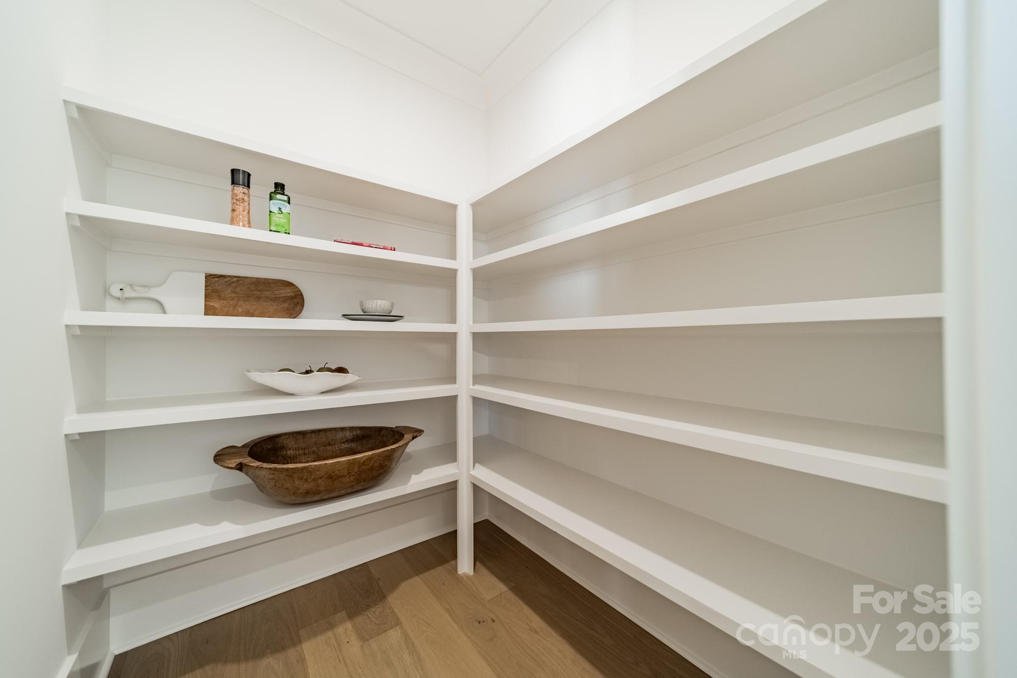 19032 Newburg Hill Road, Unit 23 Davidson, NC 28036 - Photo 10 of 39 a shelf with books and a book shelf