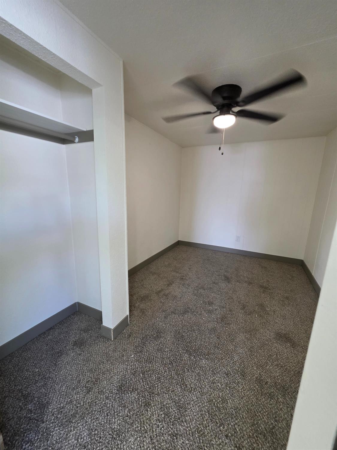 5200 Crest Road Atwater, CA 95301 - Photo 15 of 19 an empty room with a ceiling fan