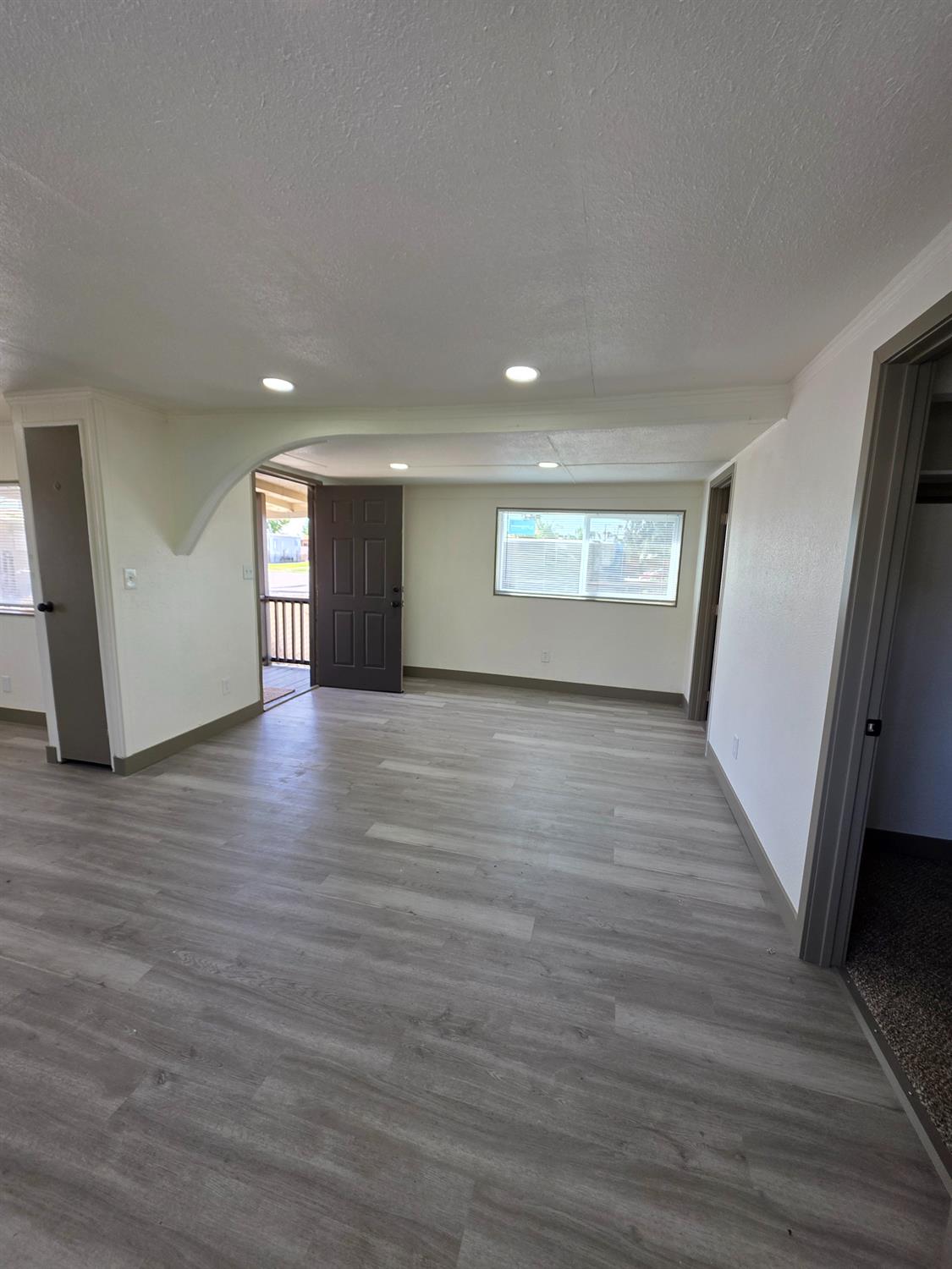 5200 Crest Road Atwater, CA 95301 - Photo 10 of 19 a view of wooden floor and windows in a room
