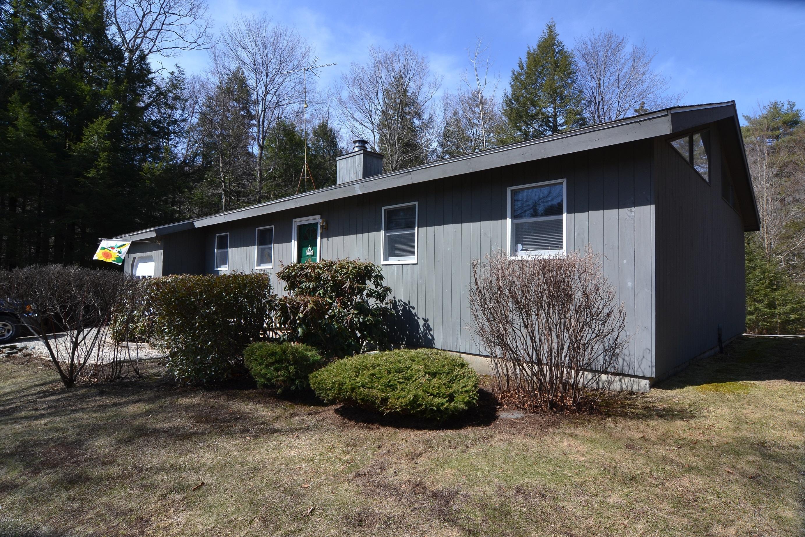 3008 Jacobs Ladder Road Becket, MA 01223 - Photo 2 of 28 a house with trees in front of it