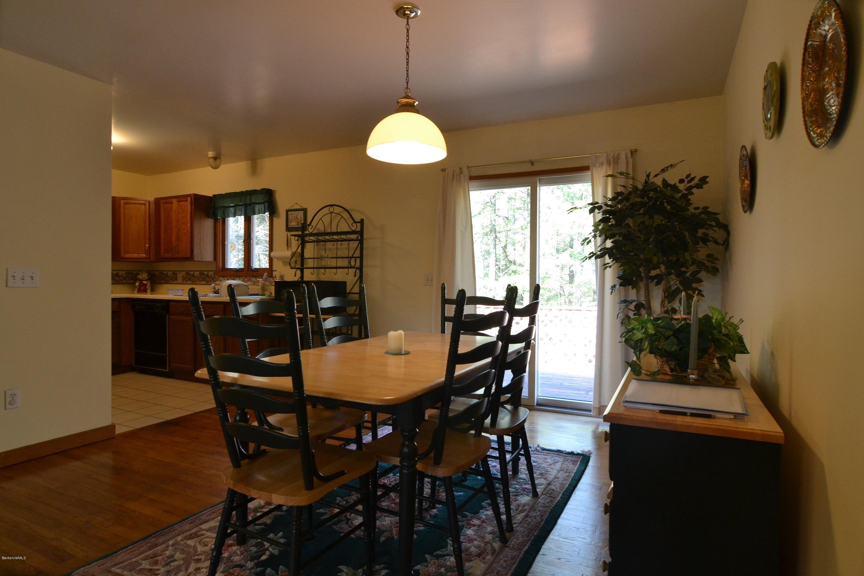 3008 Jacobs Ladder Road Becket, MA 01223 - Photo 6 of 28 a view of a dining room with furniture and window