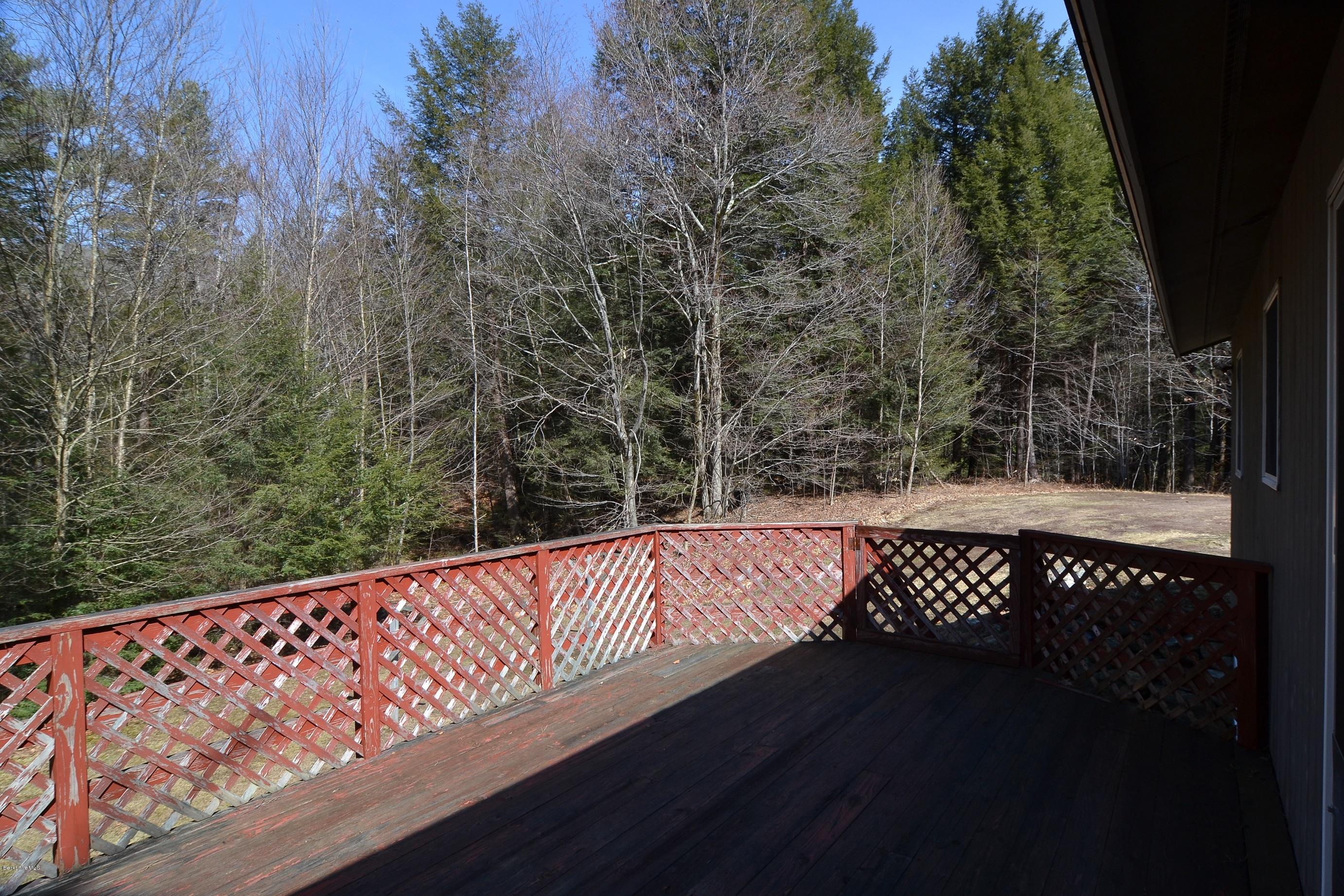 3008 Jacobs Ladder Road Becket, MA 01223 - Photo 7 of 28 a view of a roof deck with wooden fence