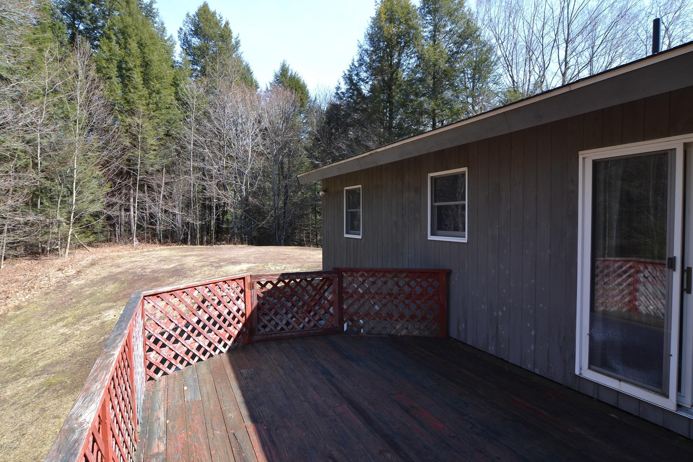 3008 Jacobs Ladder Road Becket, MA 01223 - Photo 8 of 28 a view of backyard with a patio and wooden floor