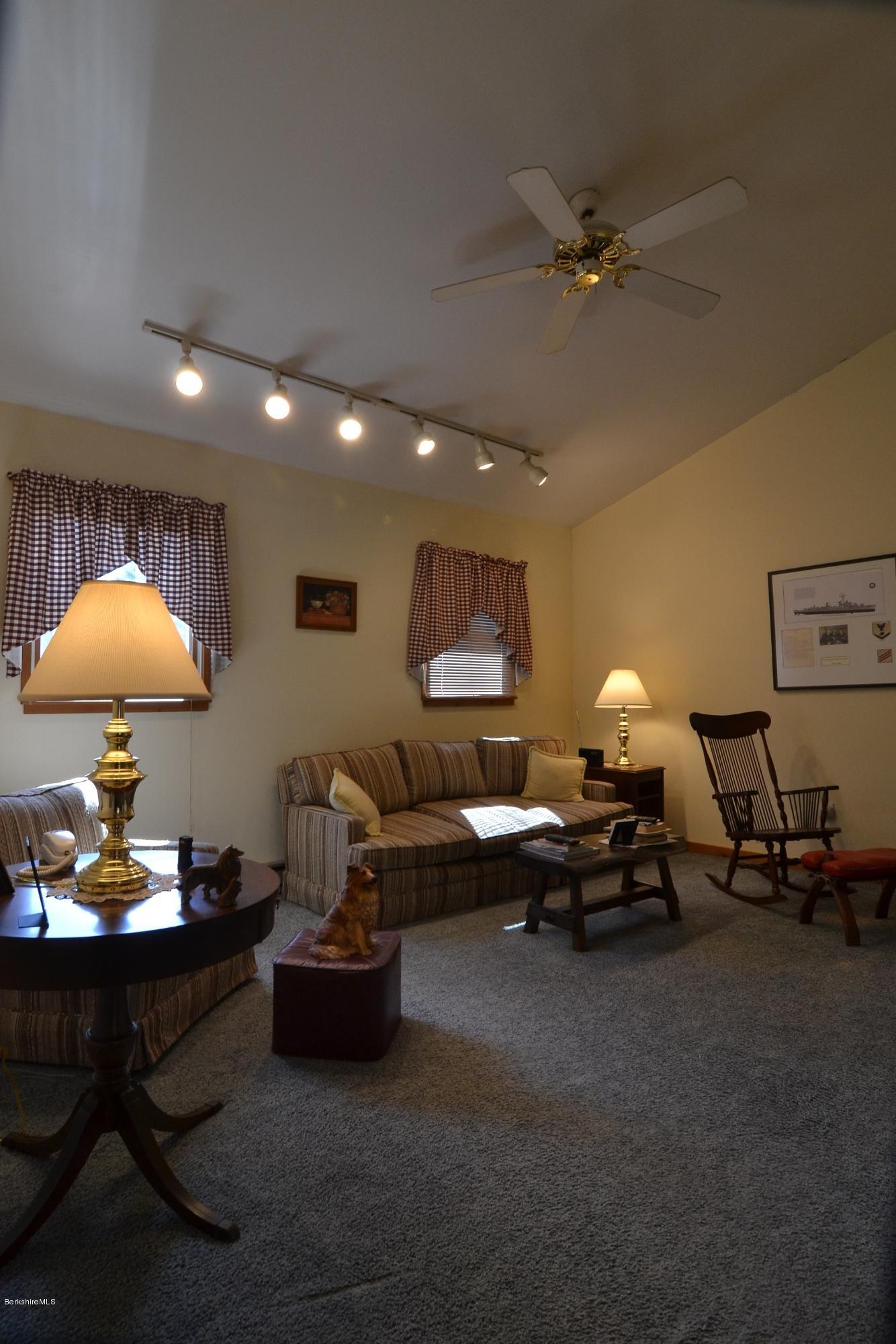 3008 Jacobs Ladder Road Becket, MA 01223 - Photo 10 of 28 a living room with furniture and a lamp