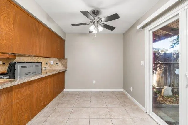 a view of a kitchen with a sink and cabinets