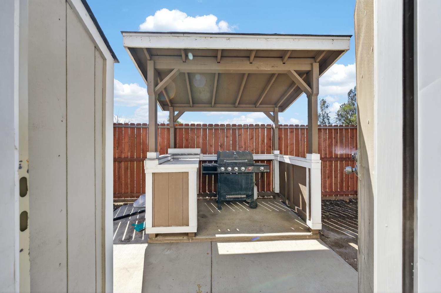 2504 Paradise Road Modesto, CA 95358 - Photo 5 of 14 a view of a patio with a table and chairs