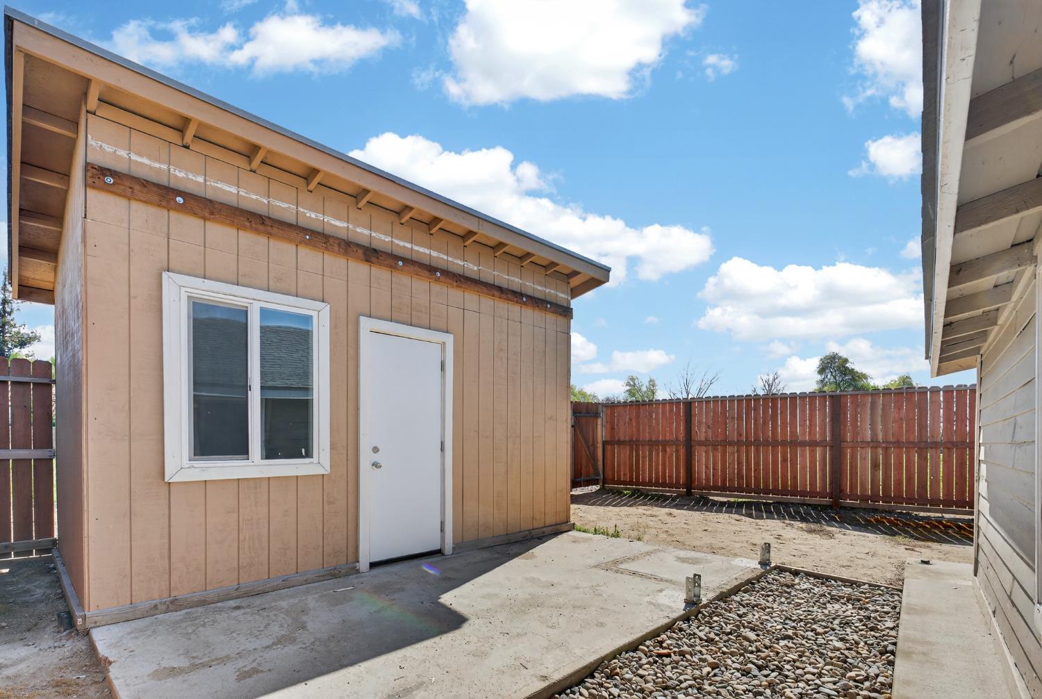 2504 Paradise Road Modesto, CA 95358 - Photo 7 of 14 a view of a house with wooden fence