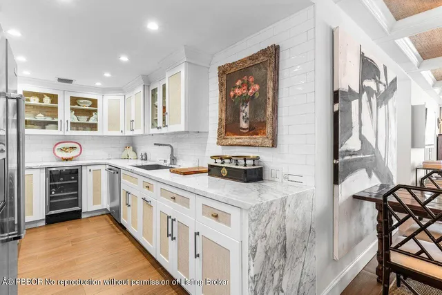 a kitchen with stainless steel appliances granite countertop a stove and a microwave