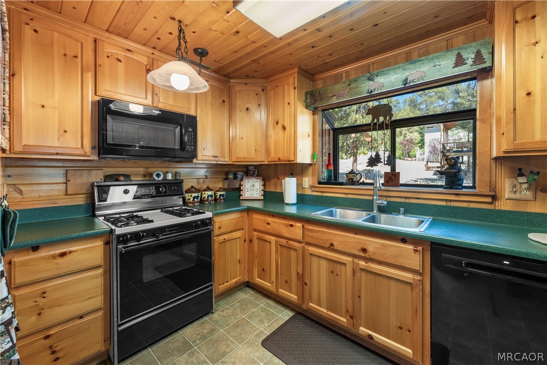 39625 Flicker Road Fawnskin, CA 92333 - Photo 2 of 47 Lots of cabinet and counter space in the kitchen plus a garden window to let you enjoy the treed view