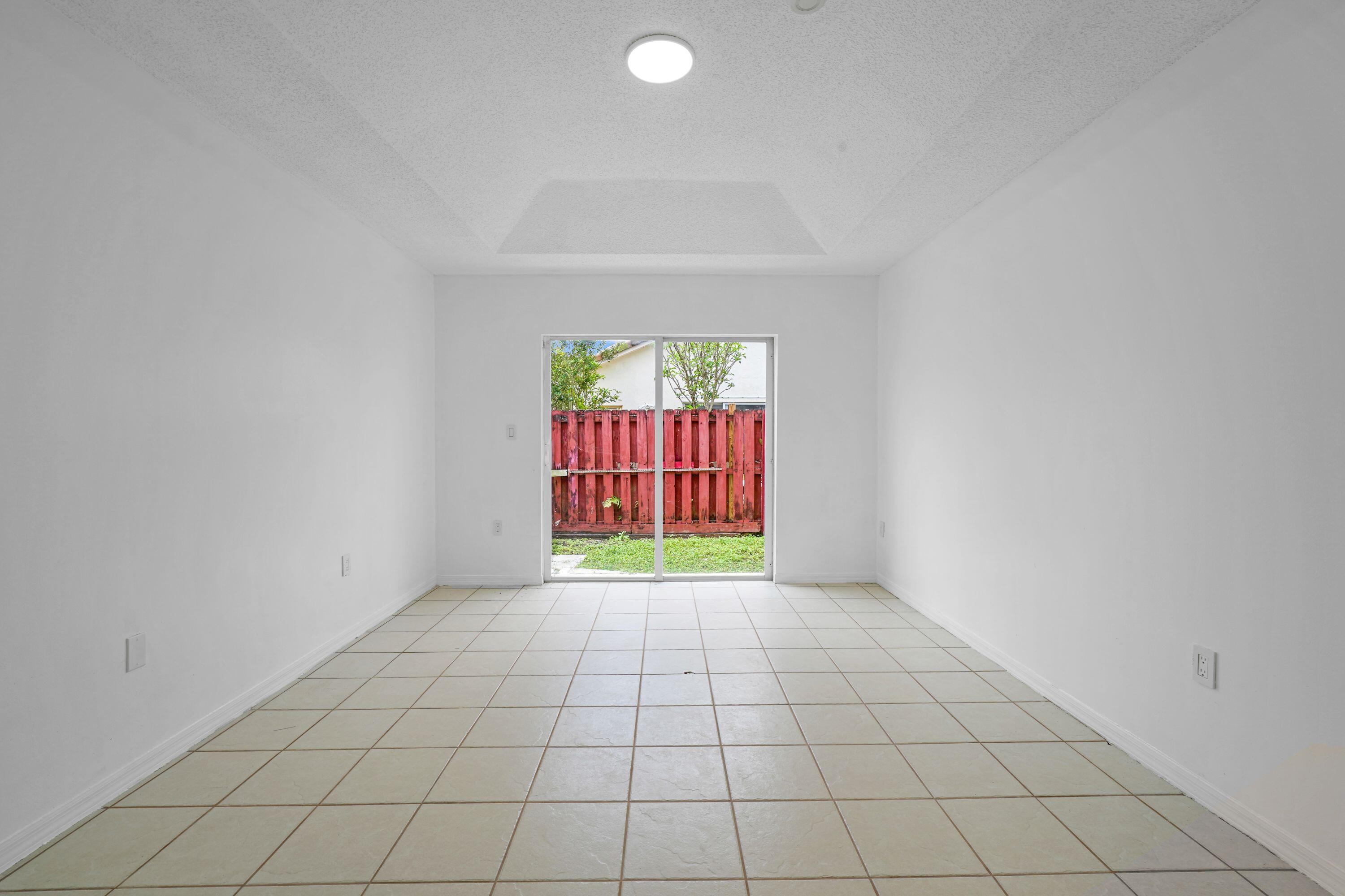 14142 Southwest 149th Court Miami, FL 33196 - Photo 15 of 48 an empty room with windows