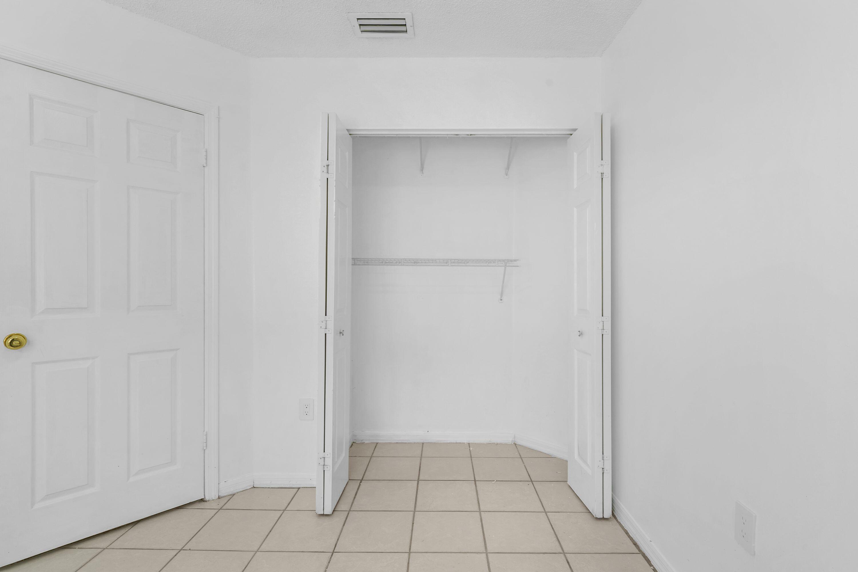 14142 Southwest 149th Court Miami, FL 33196 - Photo 22 of 48 a view of an empty room