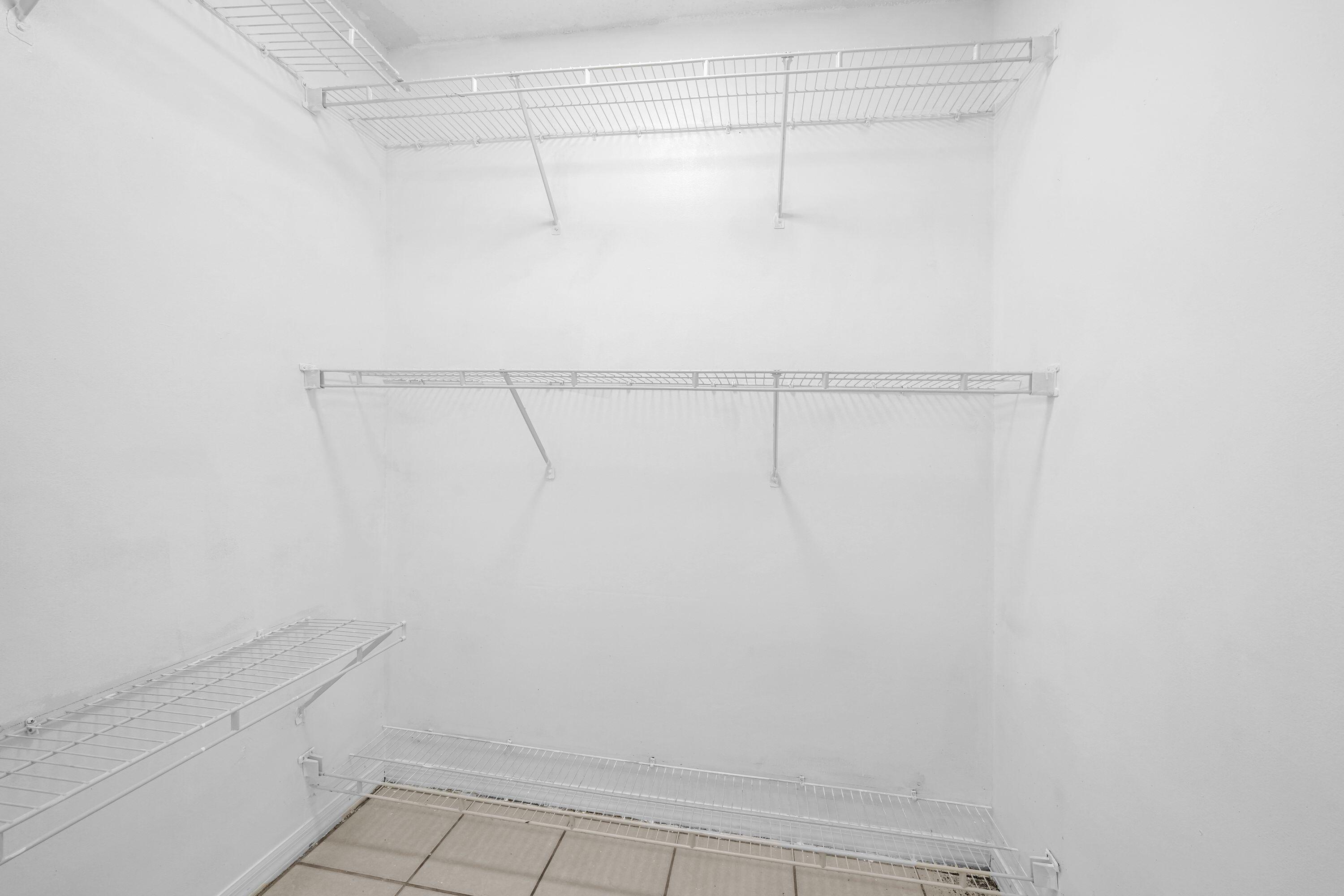 14142 Southwest 149th Court Miami, FL 33196 - Photo 23 of 48 a view of a room with racks on the wall