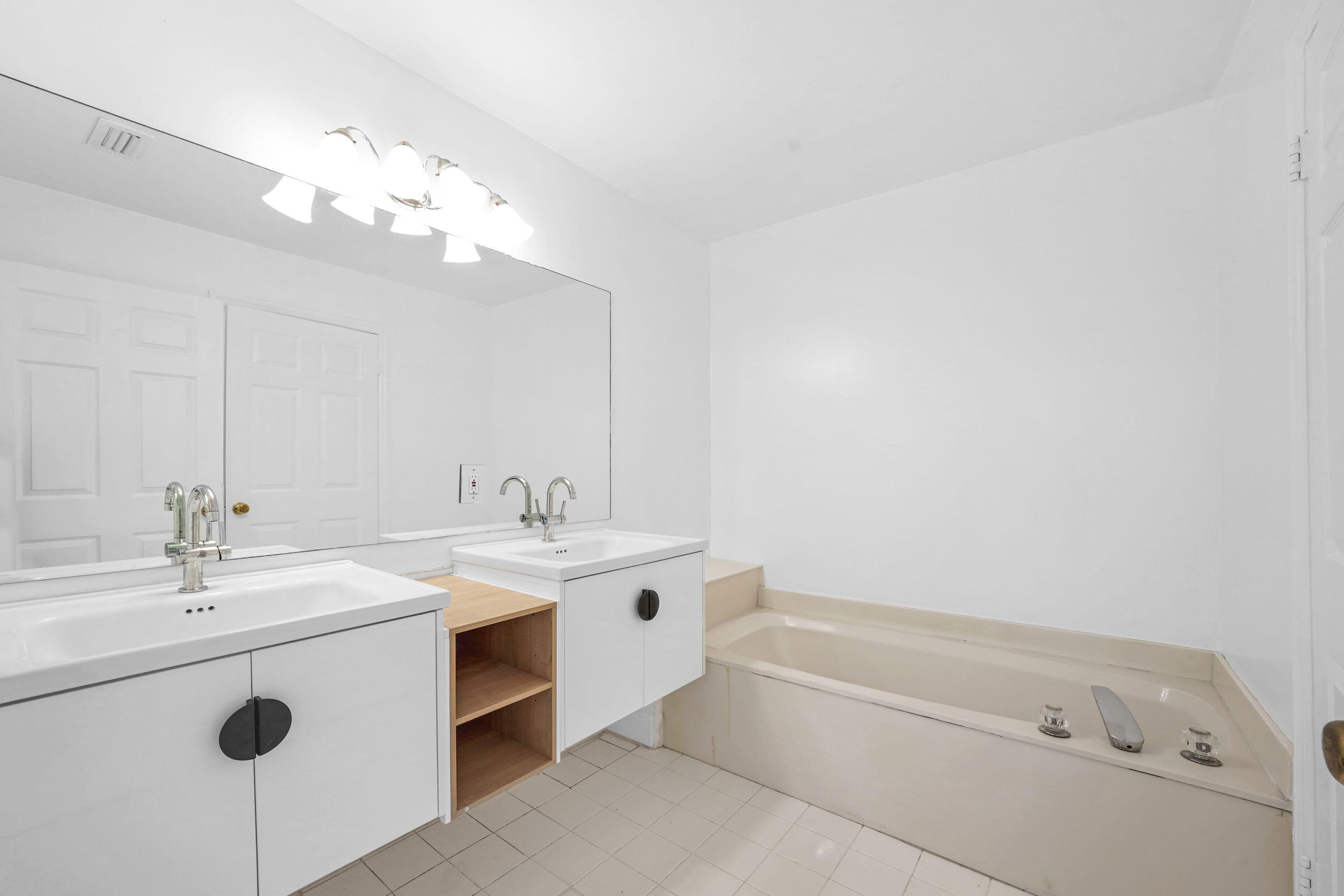 14142 Southwest 149th Court Miami, FL 33196 - Photo 24 of 48 a bathroom with a sink a tub and a mirror