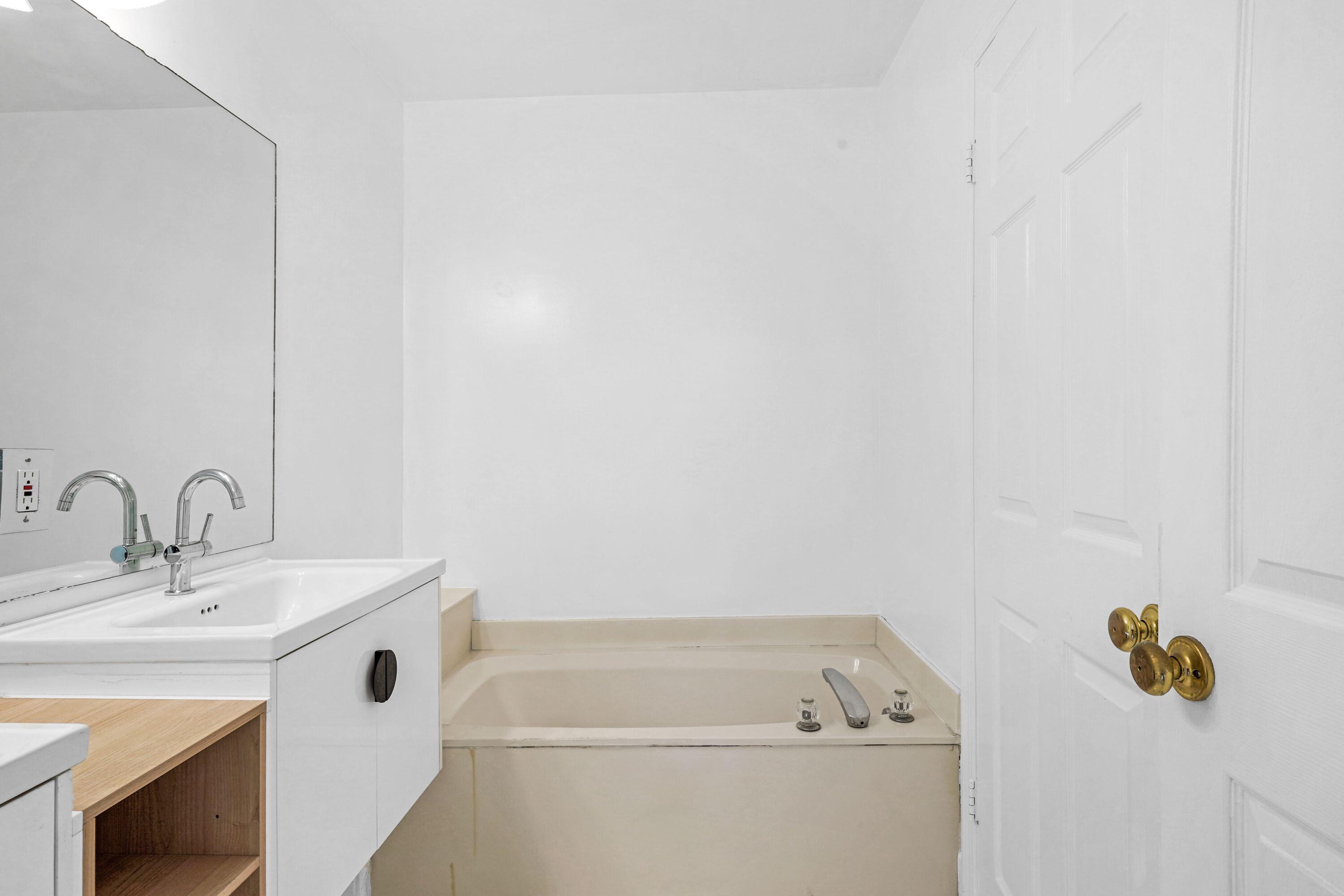 14142 Southwest 149th Court Miami, FL 33196 - Photo 25 of 48 a bathroom with a sink and a mirror