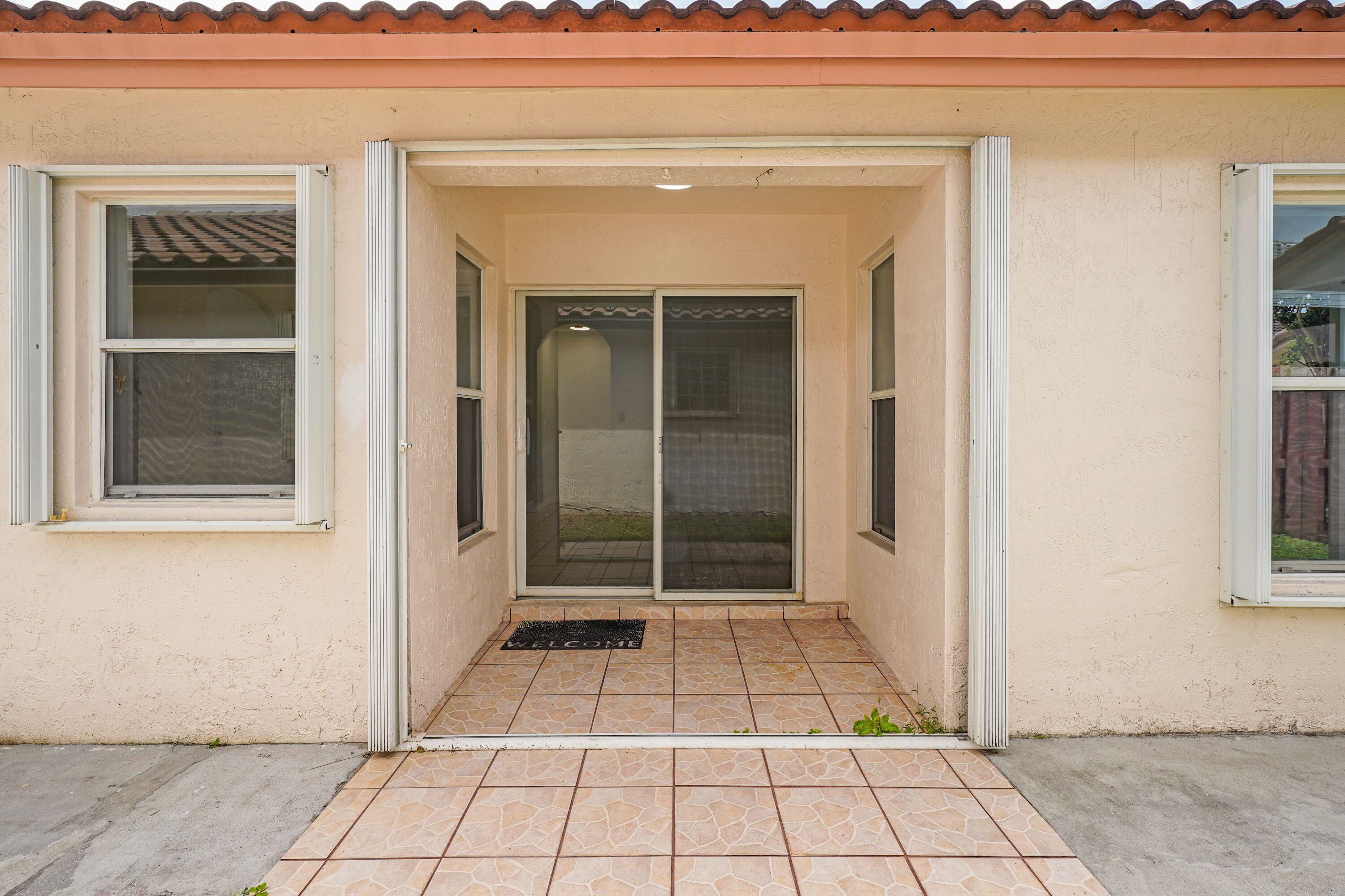 14142 Southwest 149th Court Miami, FL 33196 - Photo 32 of 48 a view of a entryway door of the house