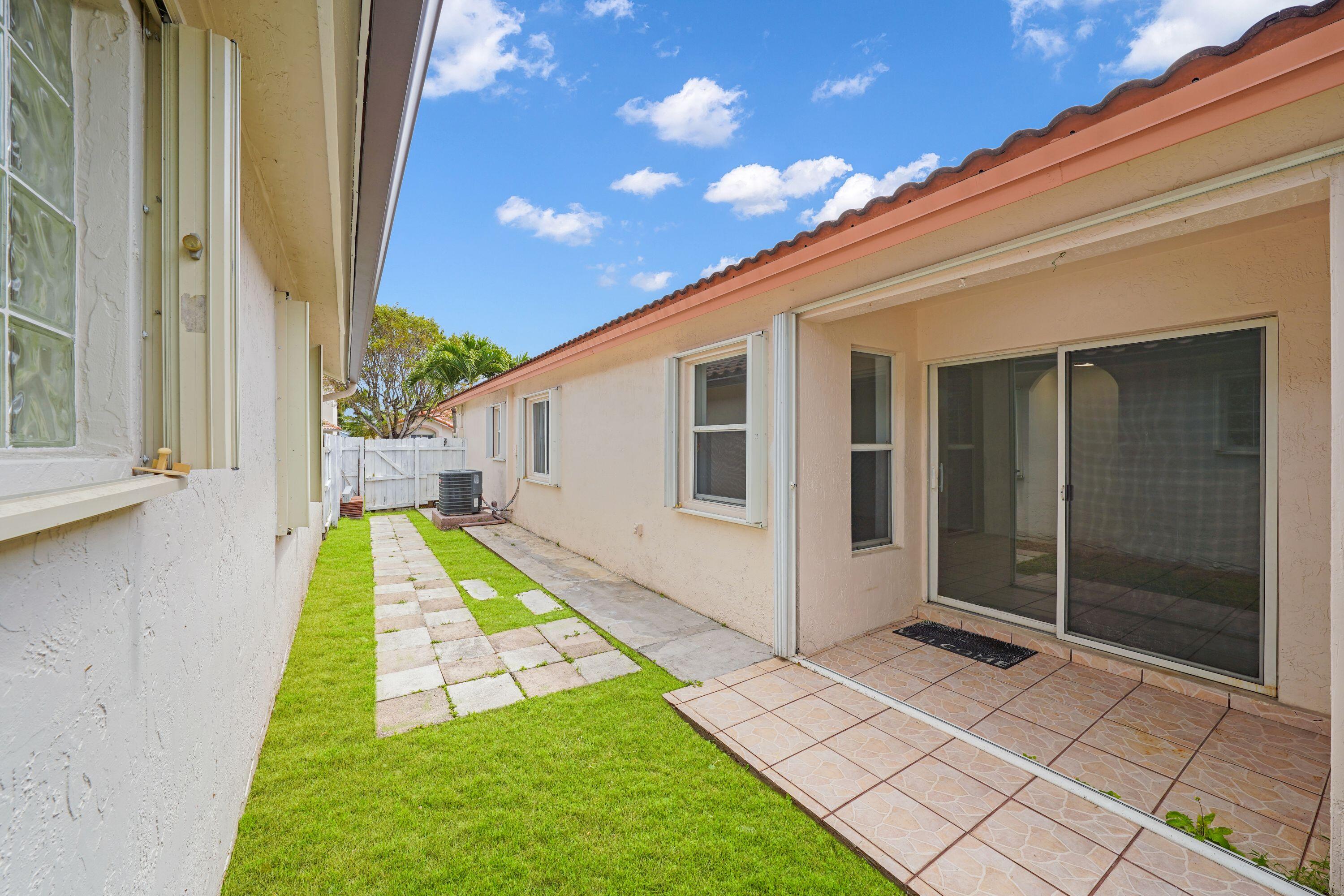 14142 Southwest 149th Court Miami, FL 33196 - Photo 33 of 48 a view of swimming pool with a backyard