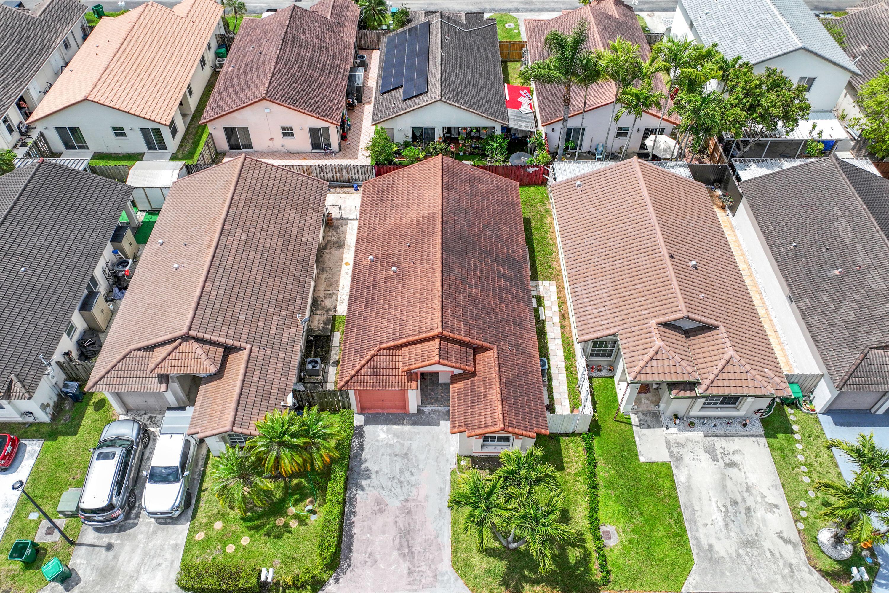 14142 Southwest 149th Court Miami, FL 33196 - Photo 41 of 48 an aerial view of multiple houses with a yard
