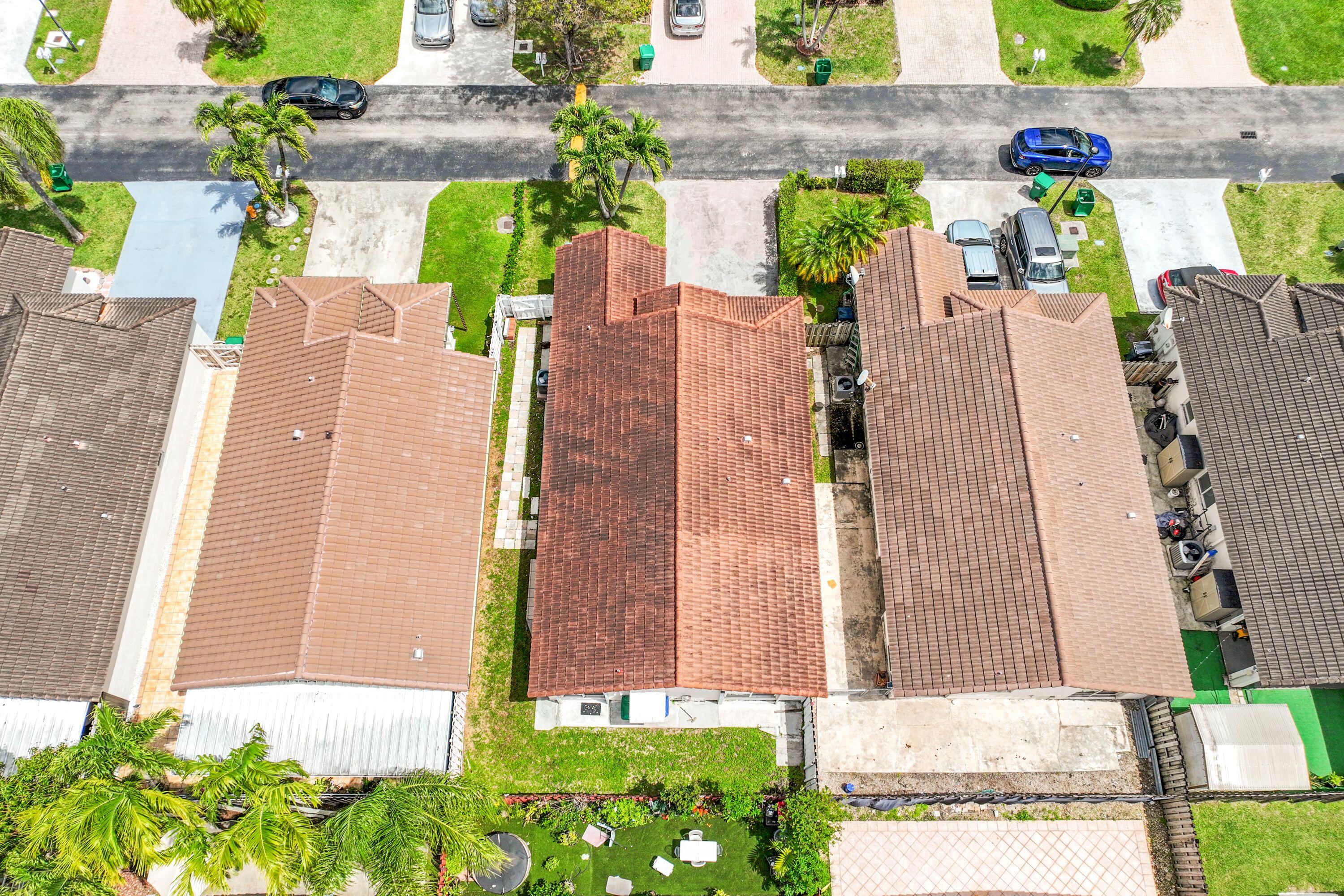 14142 Southwest 149th Court Miami, FL 33196 - Photo 42 of 48 front view of a house with a potted plant