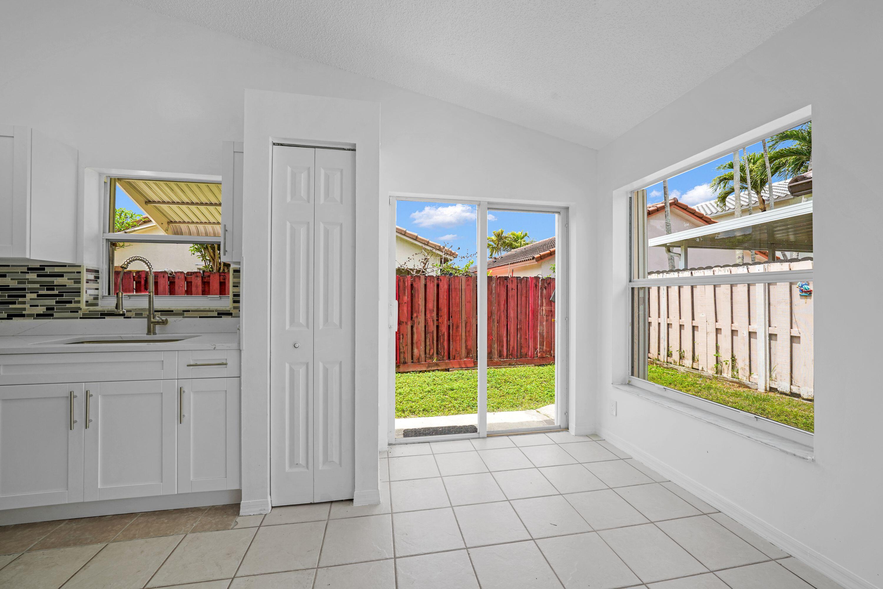 14142 Southwest 149th Court Miami, FL 33196 - Photo 8 of 48 a view of an entryway with window