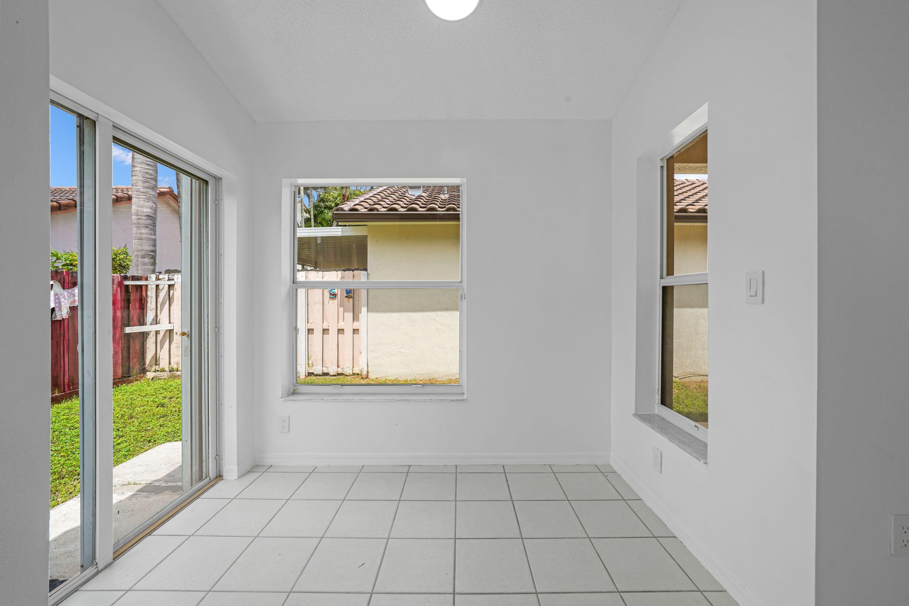 14142 Southwest 149th Court Miami, FL 33196 - Photo 9 of 48 a view of an entryway and wooden floor
