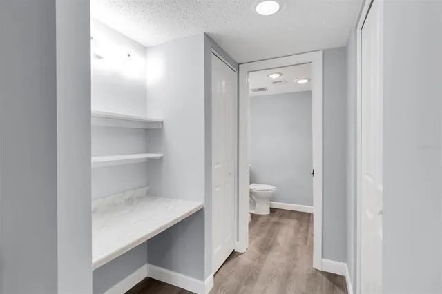 a view of a bathroom with a toilet and a view of bathroom