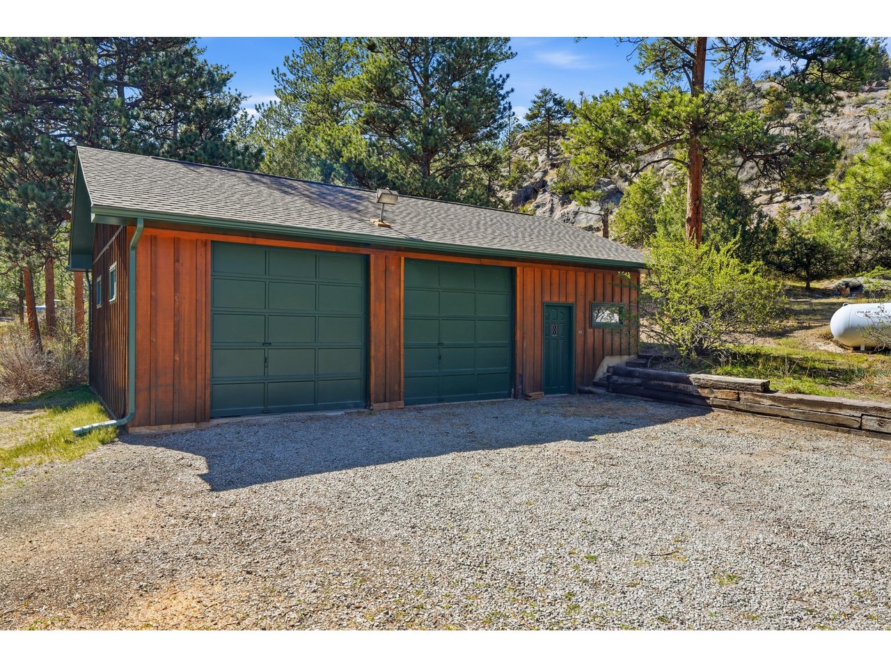 5 Mohawk Road Lyons, CO 80540 - Photo 31 of 49 Oversized two-car garage with workbench, lots of storage and EV charger. There is ample room on the property for RV's, boats and your recreational toys.