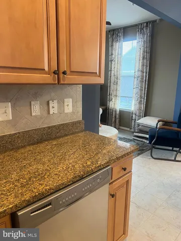 a kitchen with a granite countertop sink and a granite counter tops