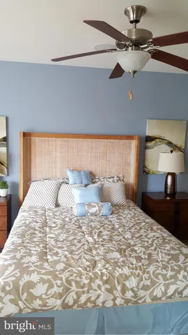 a large white bed in a white room