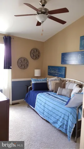 a bedroom with a bed and cabinets