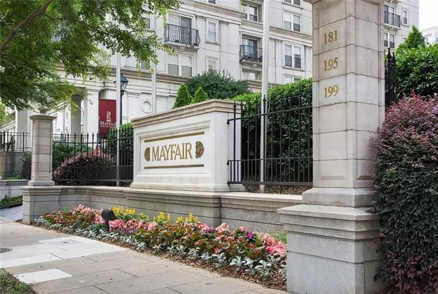 a front view of building with flowers
