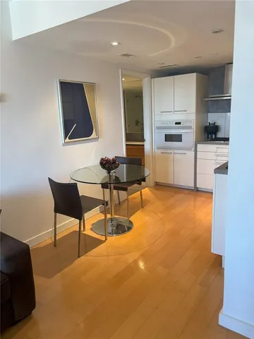 a kitchen with a table and chairs in it