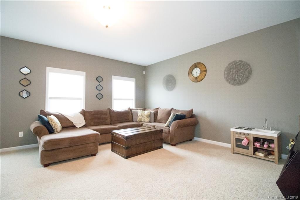 8032 Bryson Road Indian Land, SC 29707 - Photo 22 of 36 a living room with furniture and a window