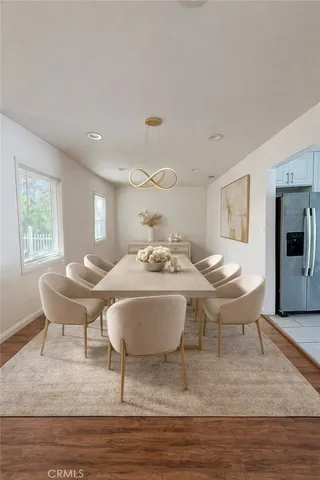 a living room with furniture a window and a table