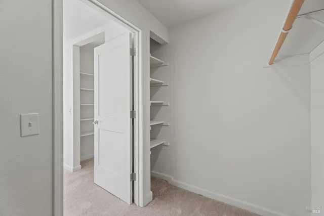 a view of an empty walk in closet