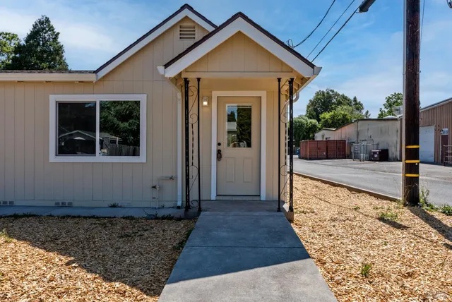 a front view of a house with a yard