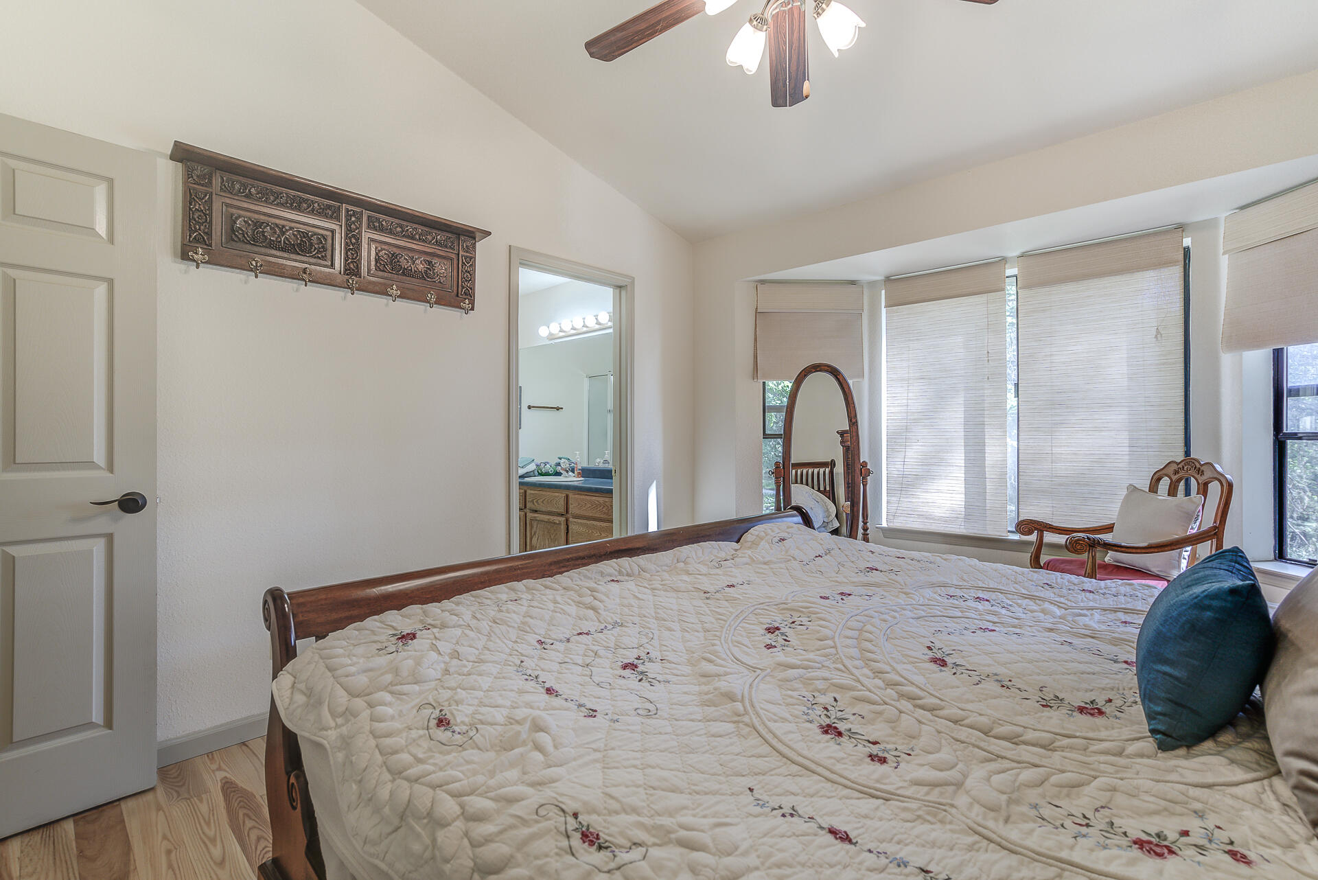 551 Salt Flat Road Lewiston, CA 96052 - Photo 11 of 29 a bedroom with a bed large window and a chandelier