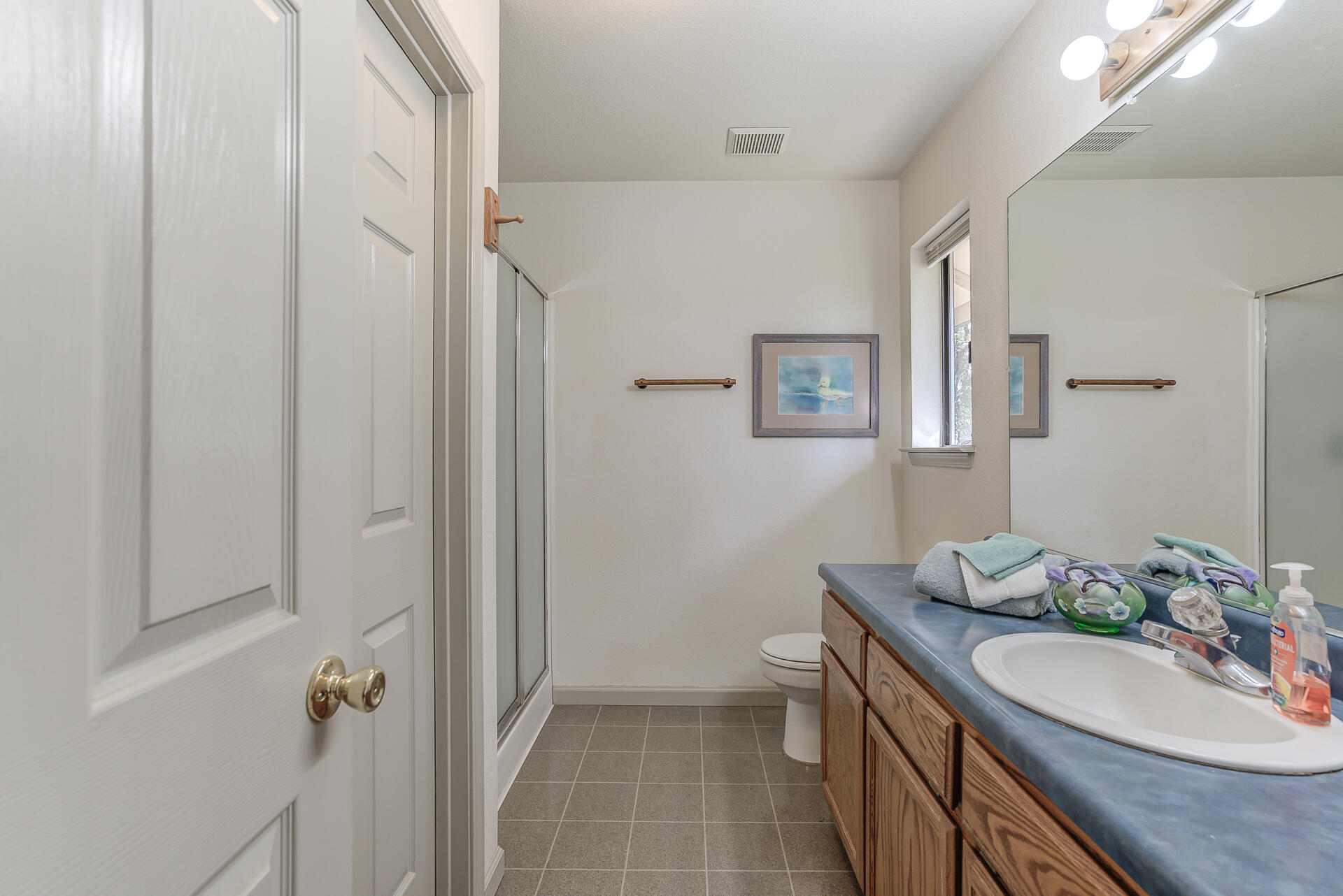 551 Salt Flat Road Lewiston, CA 96052 - Photo 12 of 29 a bathroom with a granite countertop sink a mirror and a shower