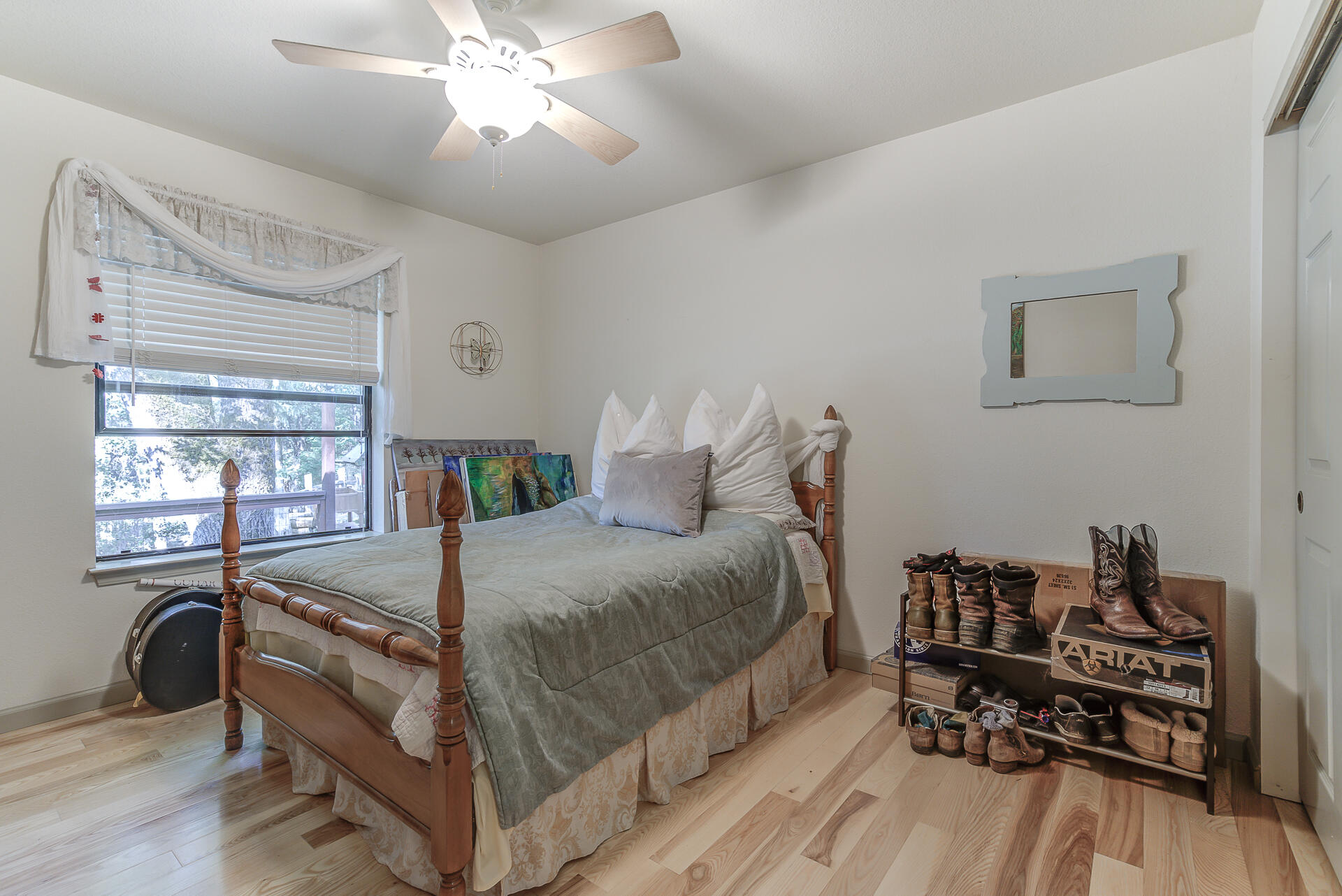 551 Salt Flat Road Lewiston, CA 96052 - Photo 13 of 29 a bedroom with a bed and a chandelier