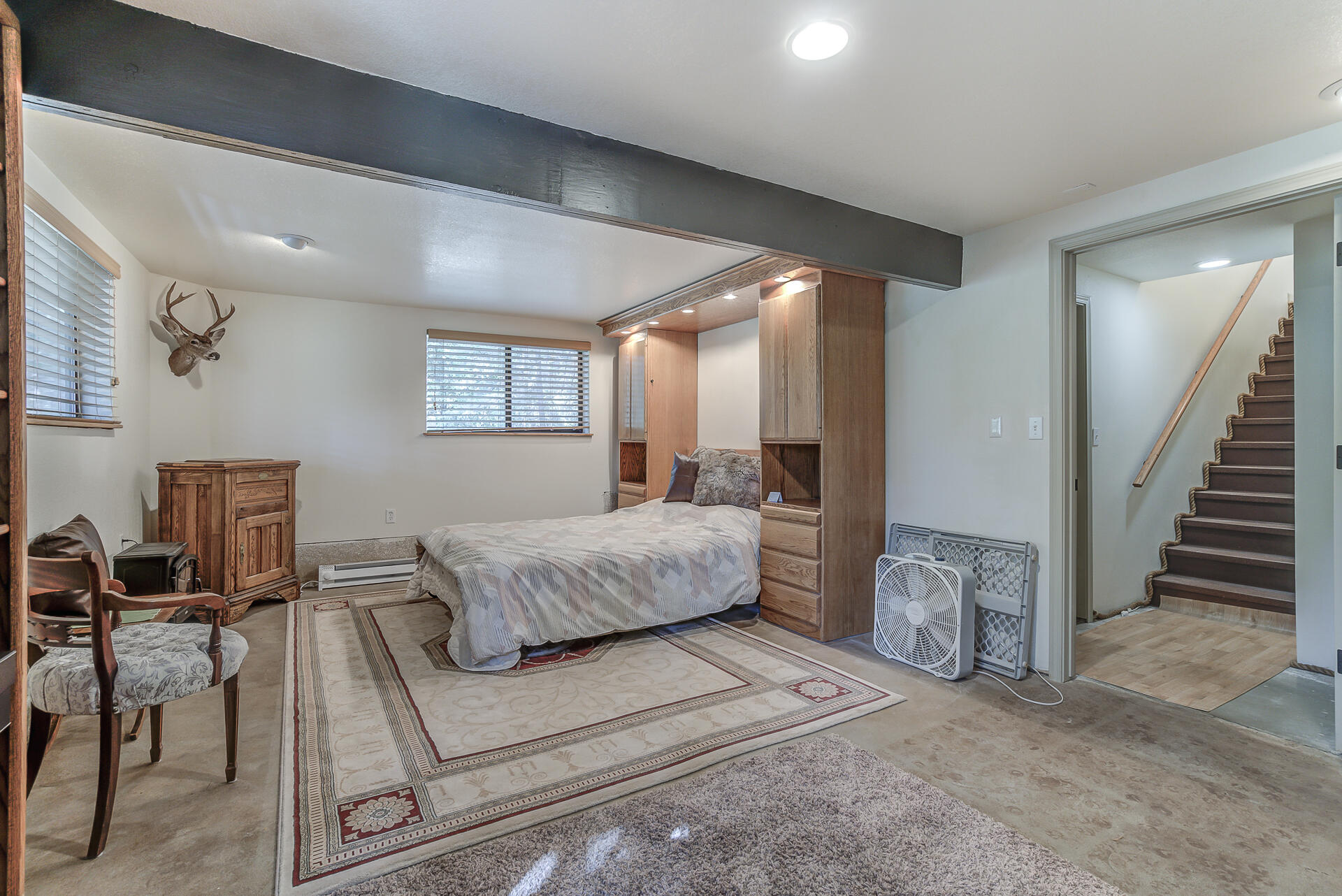 551 Salt Flat Road Lewiston, CA 96052 - Photo 17 of 29 a spacious bedroom with a large bed a table and chair