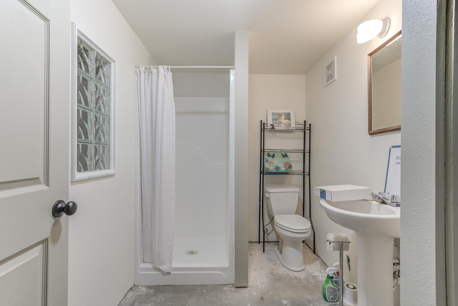 551 Salt Flat Road Lewiston, CA 96052 - Photo 20 of 29 a bathroom with a granite countertop sink a toilet and a shower