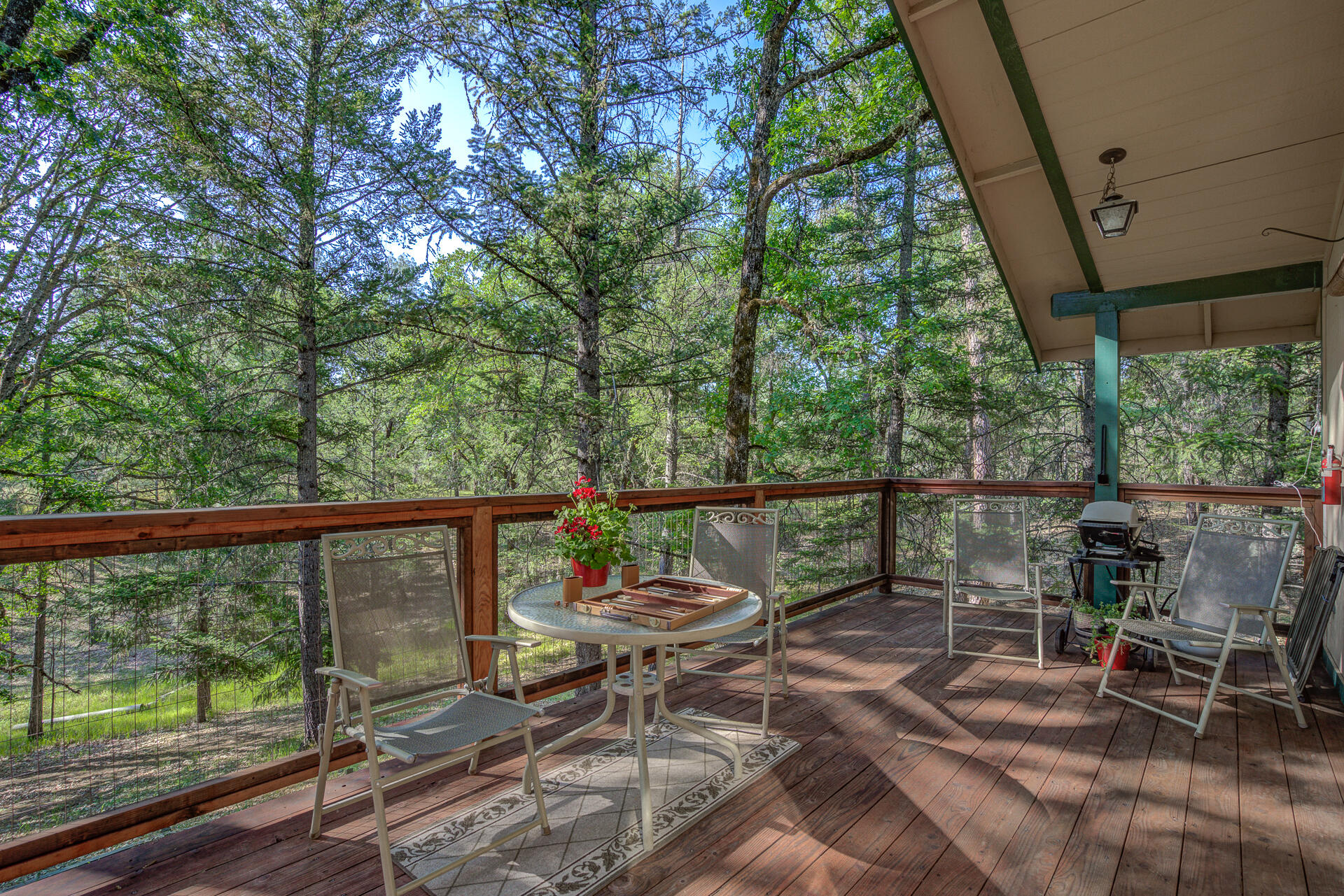 551 Salt Flat Road Lewiston, CA 96052 - Photo 25 of 29 a view of a balcony with wooden floor and outdoor seating