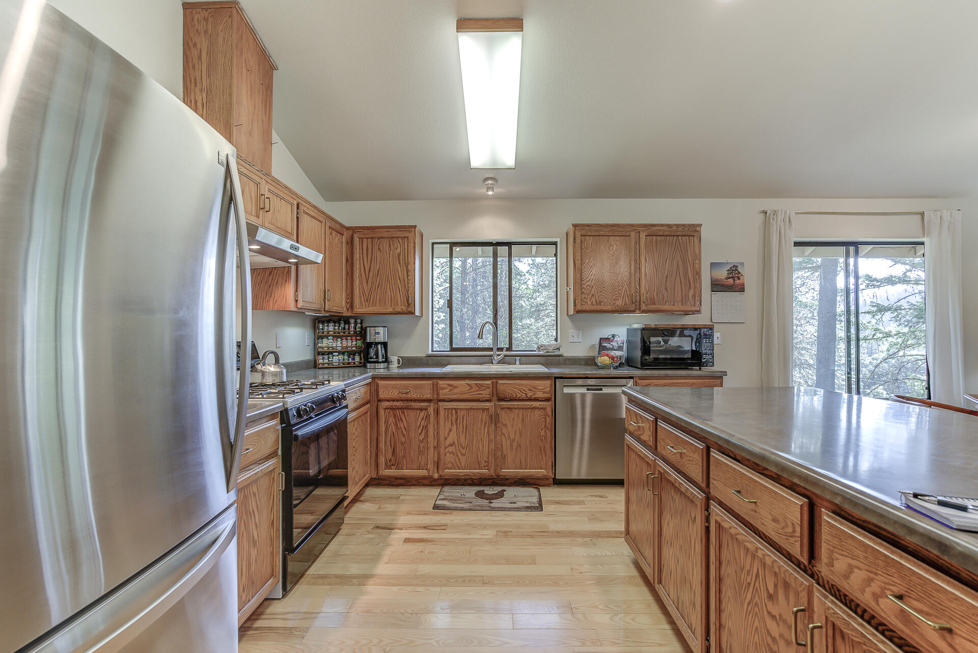 551 Salt Flat Road Lewiston, CA 96052 - Photo 8 of 29 a kitchen with granite countertop stainless steel appliances cabinets a sink and a window