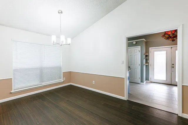 a view of an entryway with wooden floor