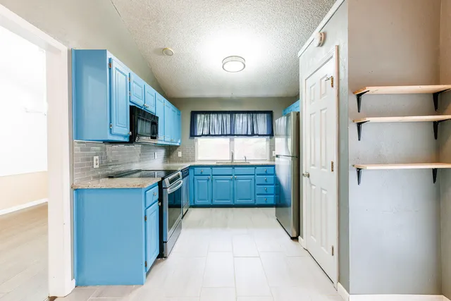a bathroom with a glass shower door