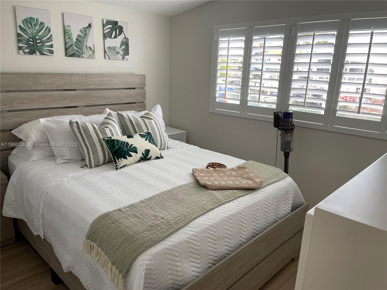 65821 Overseas Highway, Unit 82 Long Key, FL 33001 - Photo 4 of 10 a bedroom with a bed and a window