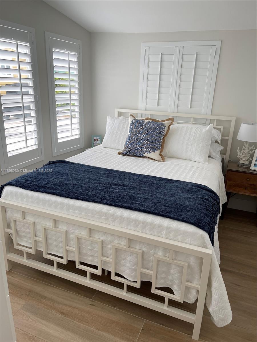 65821 Overseas Highway, Unit 82 Long Key, FL 33001 - Photo 6 of 10 a bedroom with a bed and a window