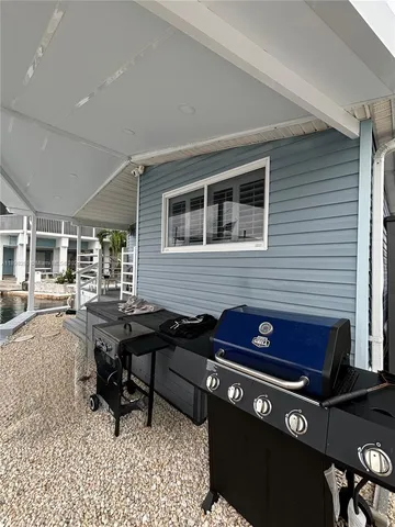 a view of a dinning table and chairs in the balcony