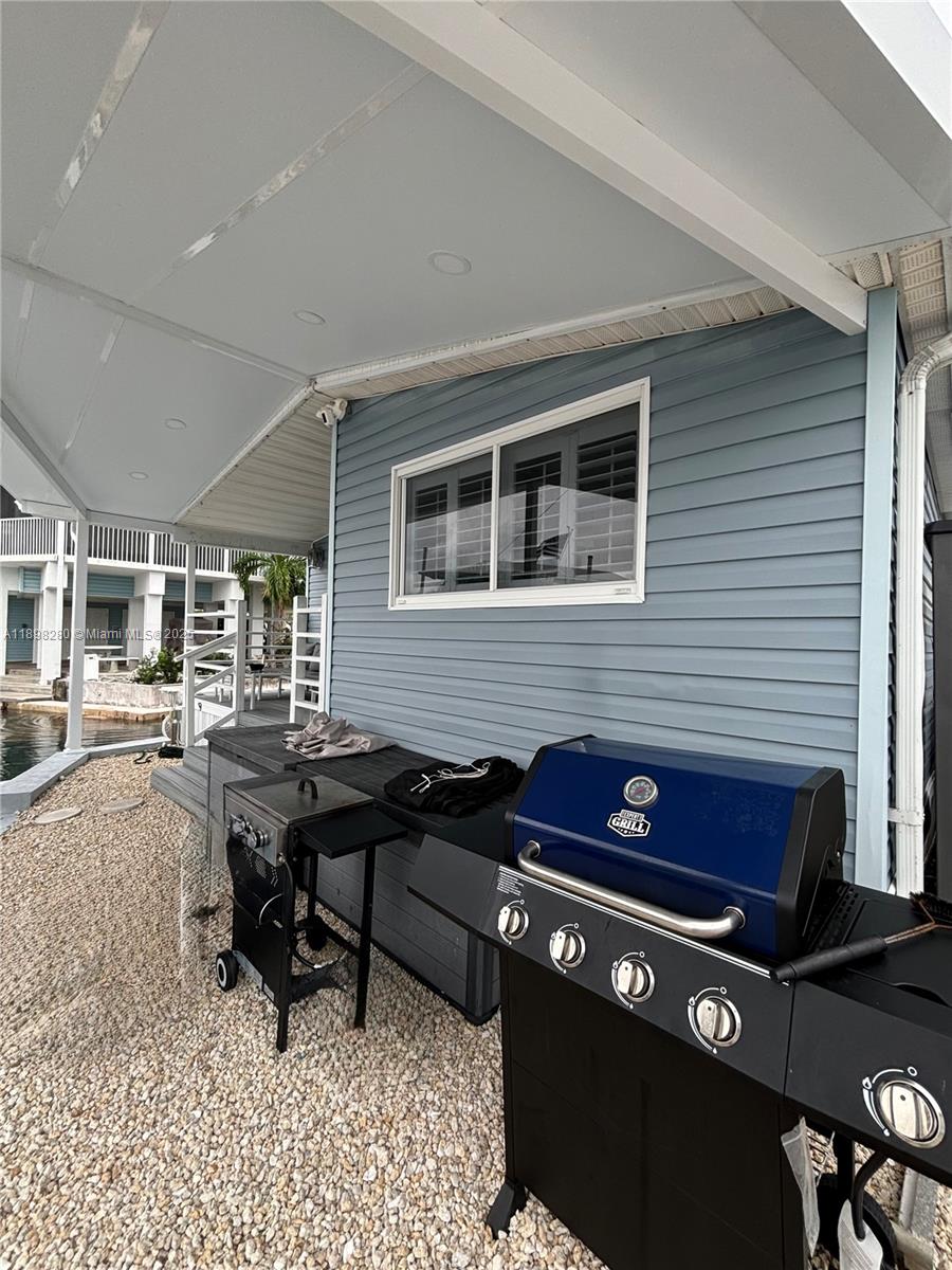 65821 Overseas Highway, Unit 82 Long Key, FL 33001 - Photo 9 of 10 a view of a dinning table and chairs in the balcony
